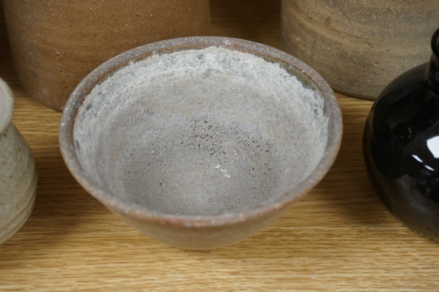 A group of Leach St. Ives pottery jugs and a pot and three other studio items of studio ceramics, some with impressed marks, largest 25cm high